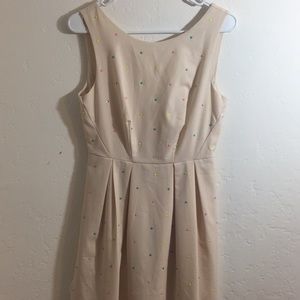 Cute, beige dress with polka dots